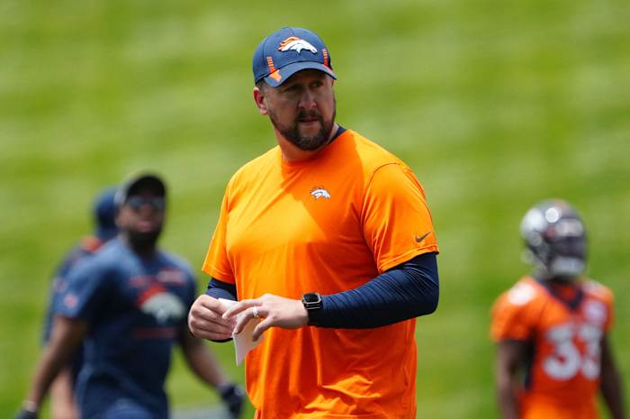 Jun 6, 2022; Englewood, Colorado, USA; Denver Broncos offensive coordinator Justin Outten during OTA workouts at the UC Health Training Center. Mandatory Credit: Ron Chenoy-USA TODAY Sports